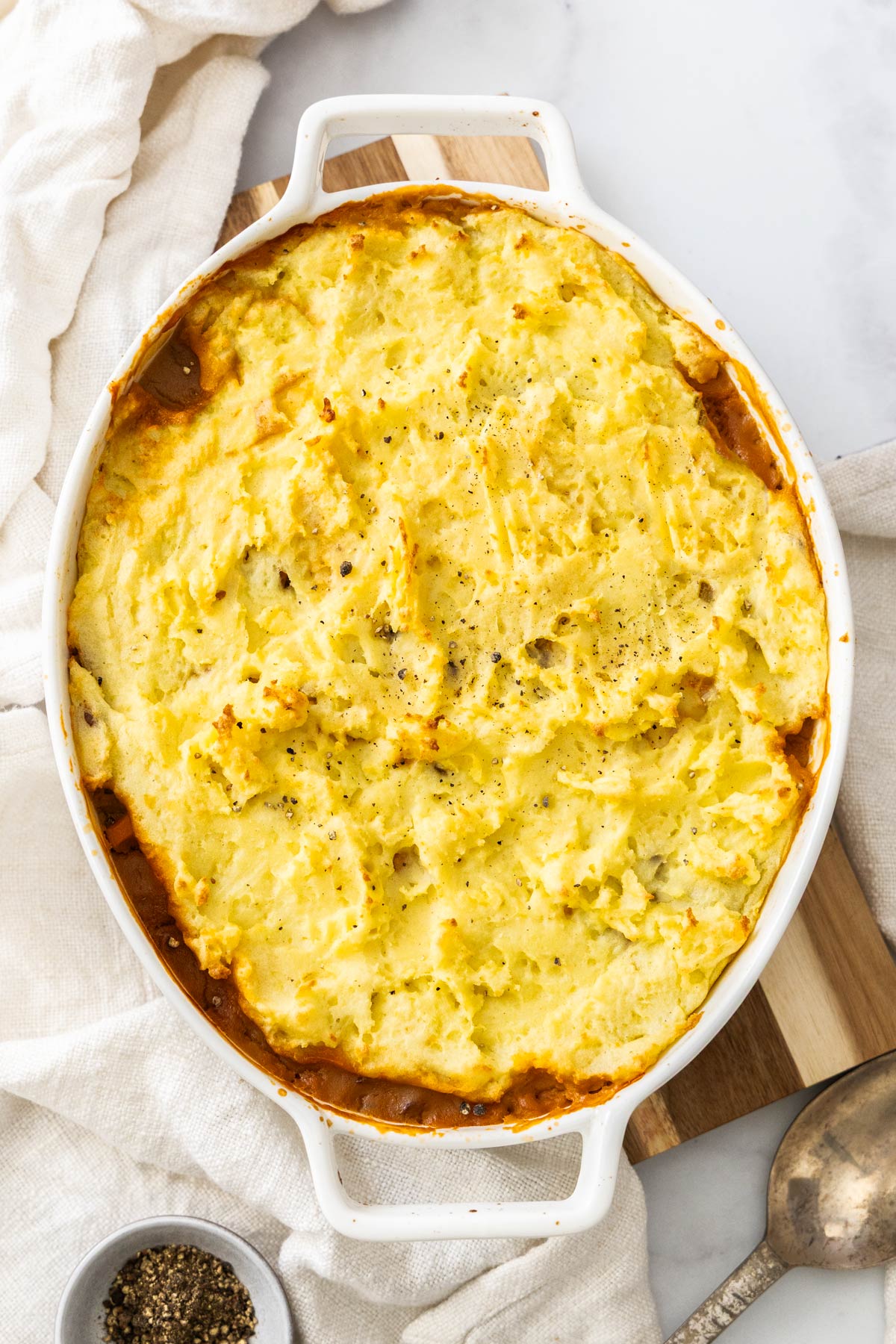 Overhead photo of vegetarian shepherd's pie in a white casserole dish