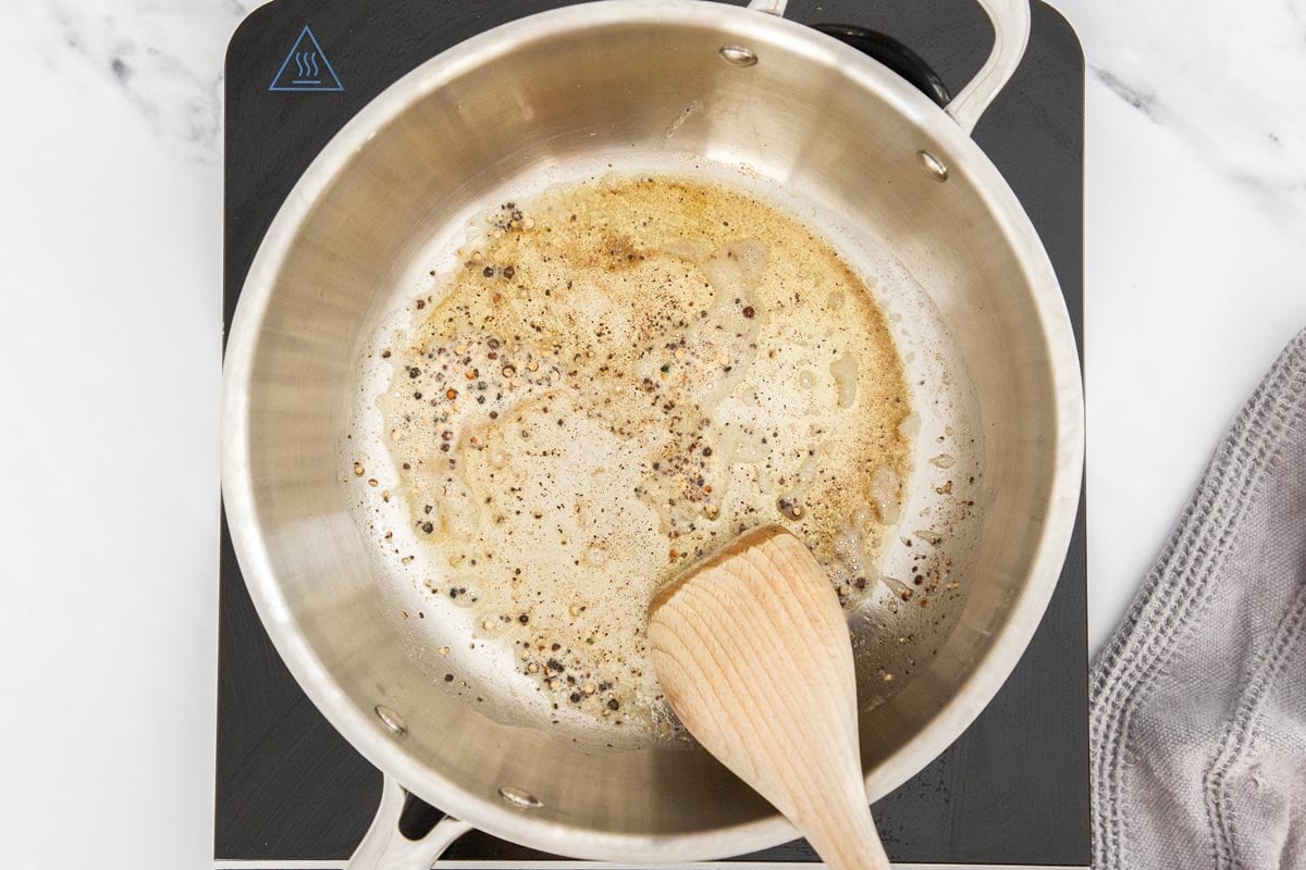 Butter and black pepper in a stainless steel skillet